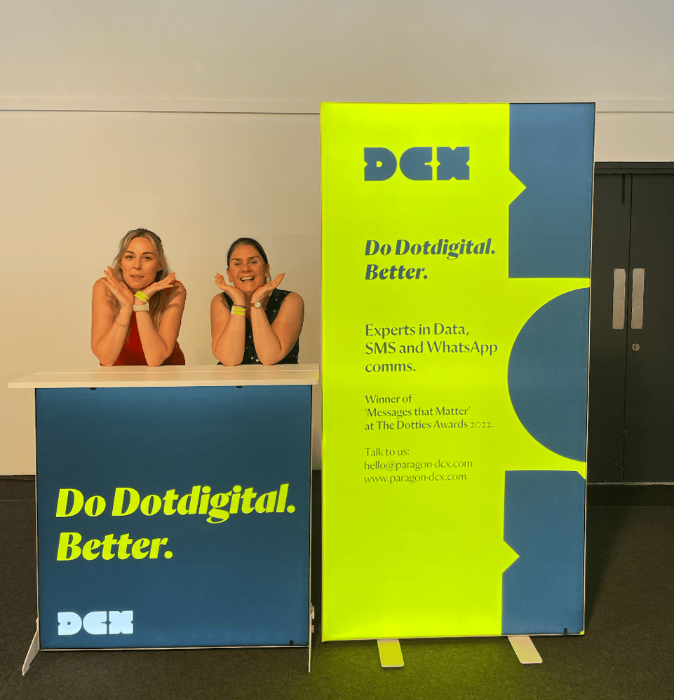 two-women-posing-by-dotdigital-exhibition-stand